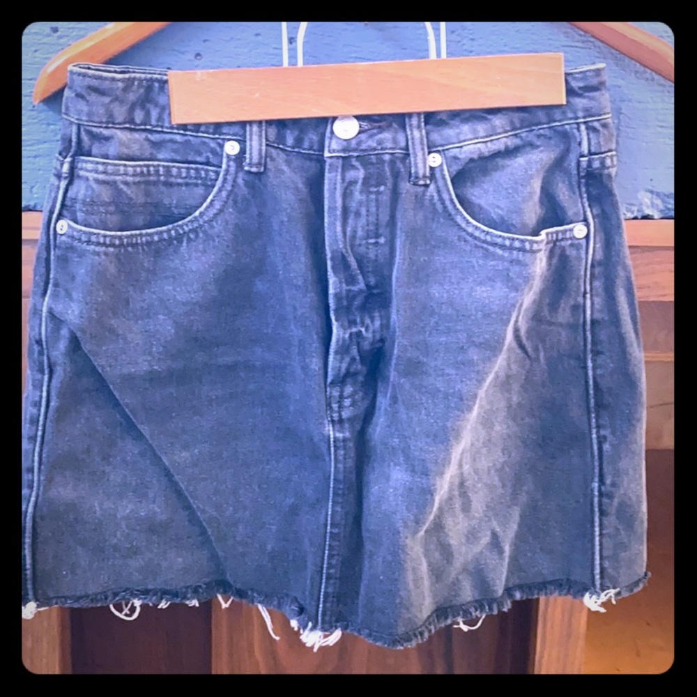 Black jean skirt. Raw hem